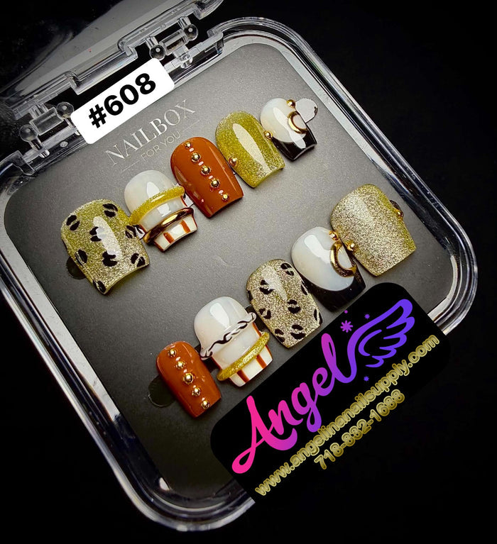 Set of decorative nail art designs in a clear display case with 'Angel' branding.