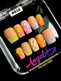 Set of decorative false nails in a display case with 'Angel Nails' branding.