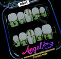 Nail art display with green and gold design in a clear case, featuring 'Angel' brand.