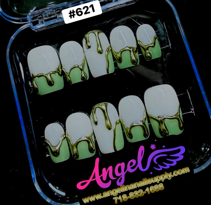 Nail art display with green and gold design in a clear case, featuring 'Angel' brand.