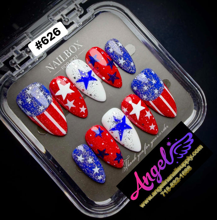 Nail art designs in red, white, and blue on a tray with 'NAILBOX' branding.