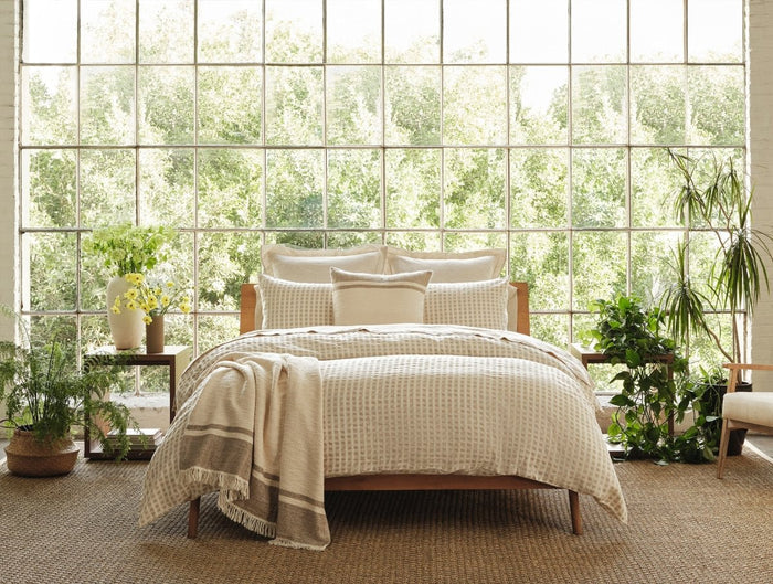 Coyuchi Pampas Organic Throw Blankets shown on Bed at Fig Linens and Home