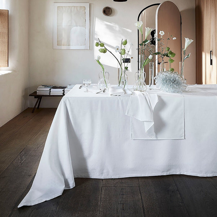 Voyage Iconique White Tablecloth By Le Jacquard Francais at Fig Linens and Home 1