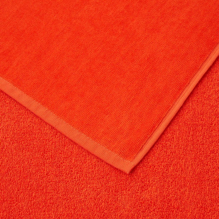 Zuma Sculpted Beach Towel by Hugo Boss Home | Yves Delorme Spice Pool Towel at Fig Linens and Home 4